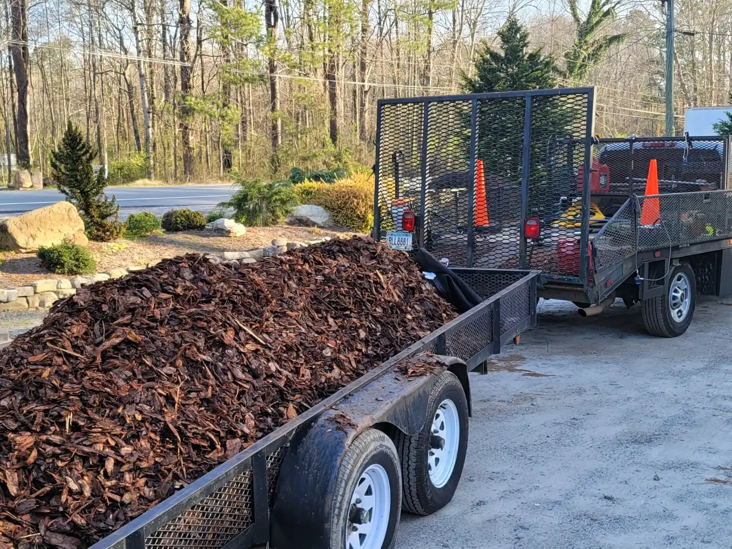 Trailer loaded with bark mulch for a landscape bed refresh